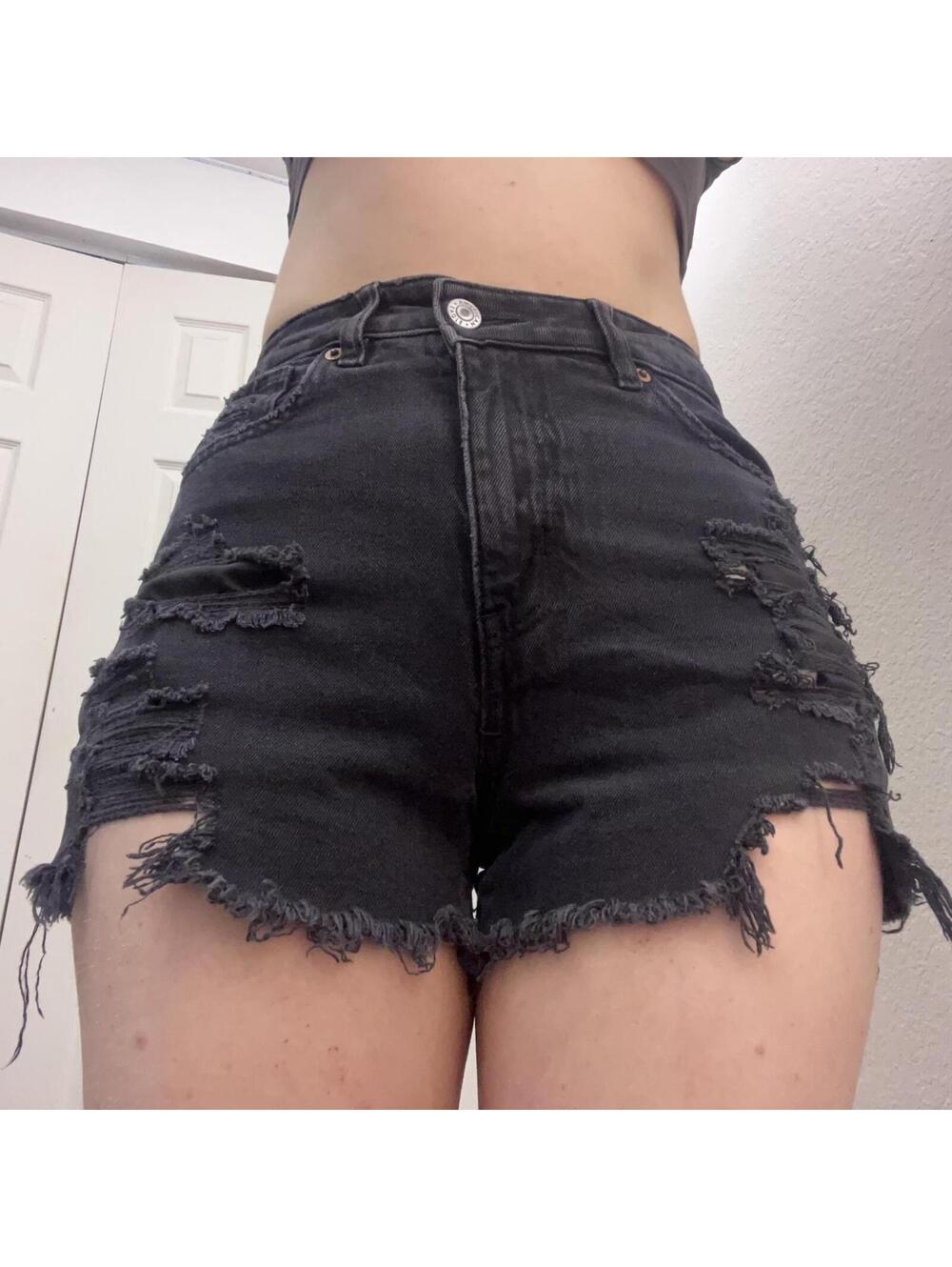 Black denim shorts with frayed hem